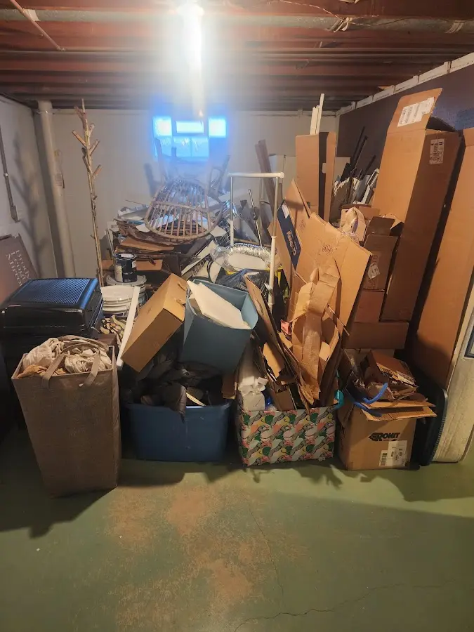 Roll-off dumpster container at job site for Yard Waste Dumpster Rental in Broken Bow